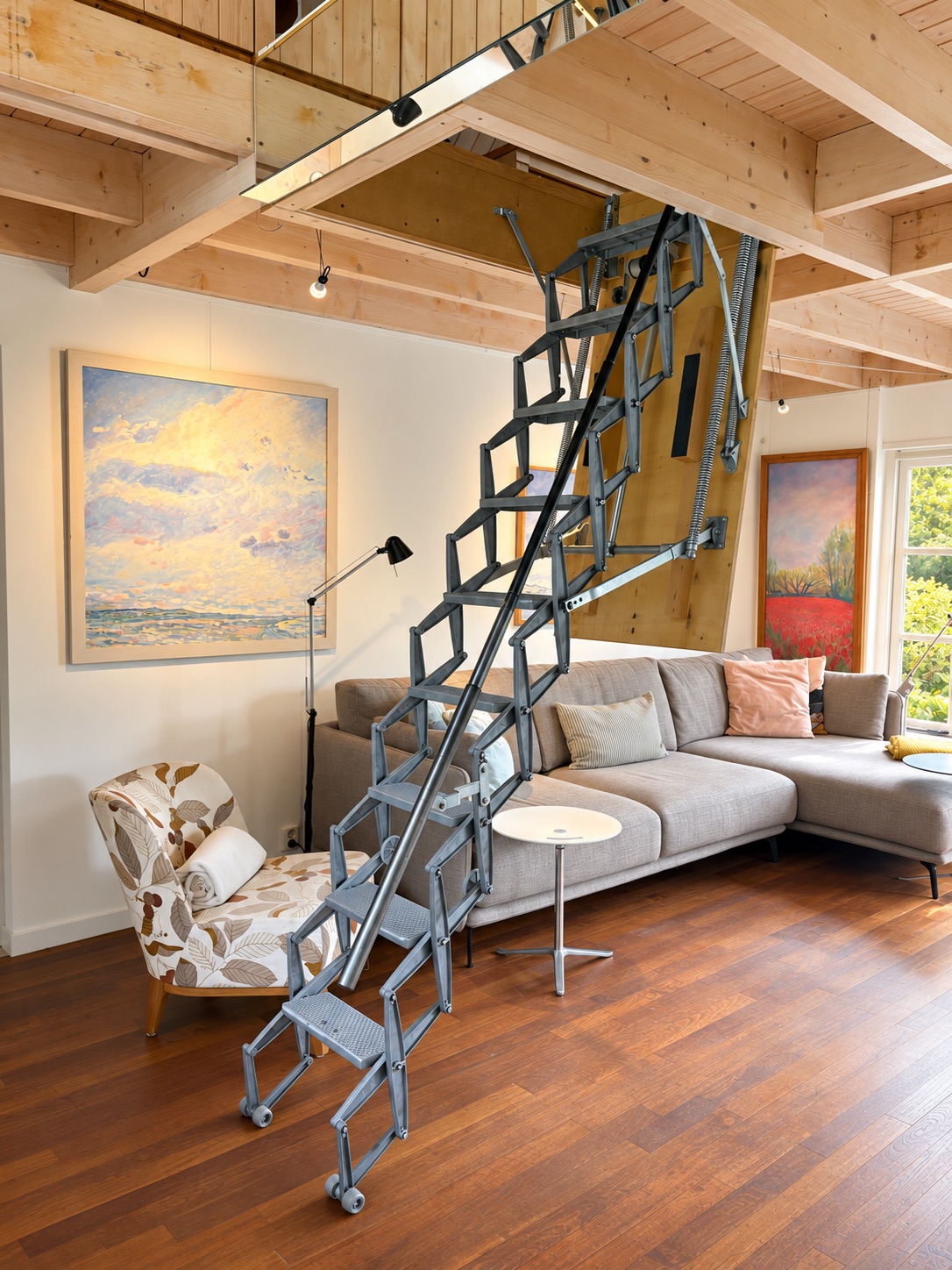 The stairs to the mezzanine beside the living room